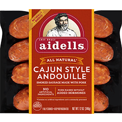 Package of Aidells All Natural Cajun Style Andouille smoked sausage links with red label, chef illustration, and sausages visible behind
